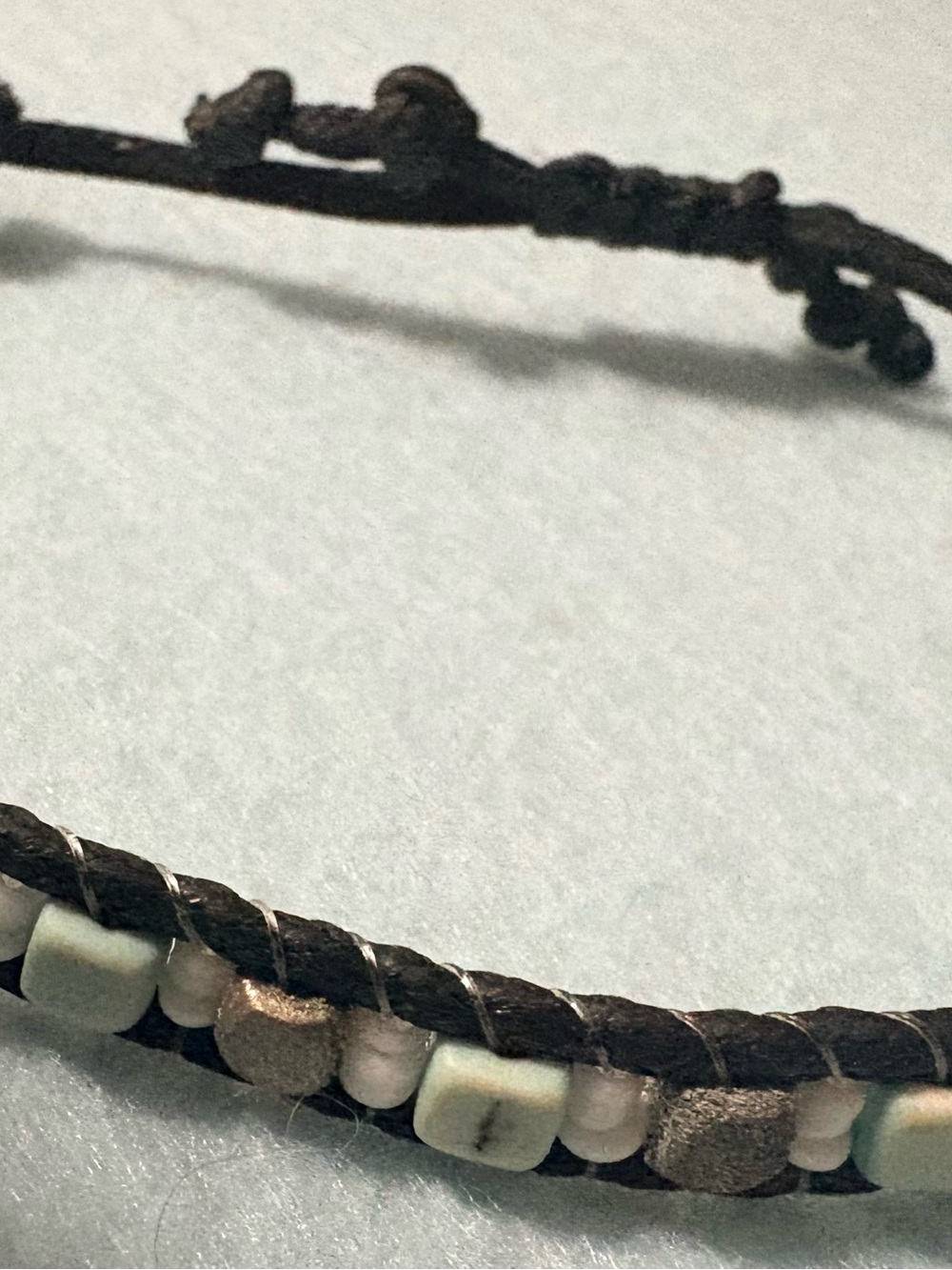 handmade beaded wrap bracelet featuring square & round beads woven black cords